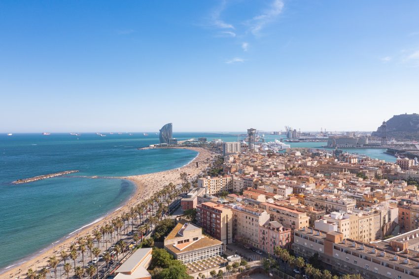 Aerial view of Barceloneta Beach and Port Vell in Barcelona, Spain