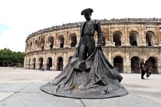 Statue outside Nimes Roman Amphitheatre